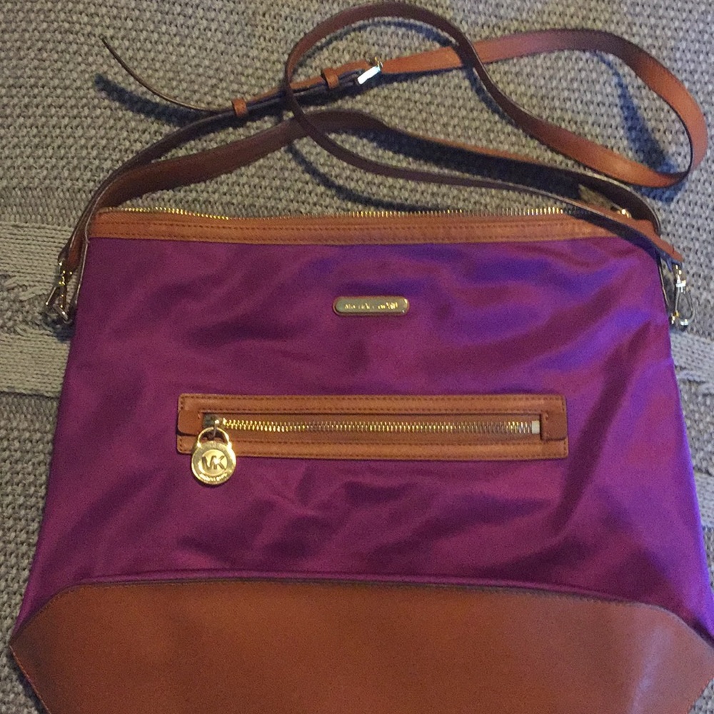 Purple and brown leather trim large crossbody bag.